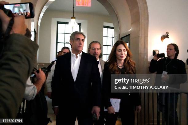 Donald Trump's former attorney Michael Cohen and his wife Laura Shusterman return after a break in the former president's civil fraud trial at New...