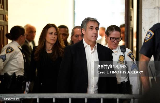 Donald Trump's former attorney Michael Cohen and his wife Laura Shusterman return after a break in the former president's civil fraud trial at New...