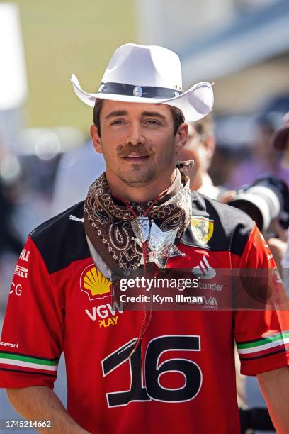 Charles Leclerc of Monaco and Scuderia Ferrari looks on from the paddock during previews ahead of the F1 Grand Prix of United States at Circuit of...