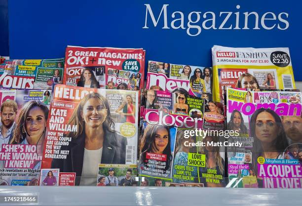 Popular magazines that have been published primarily for the readership of women feature images of the British Royal Family on a newsstand in a...