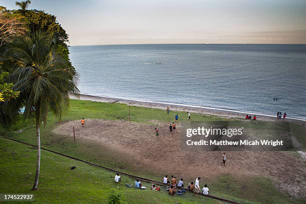 locals play soccer alongside the ocean - livingston guatemala stock pictures, royalty-free photos & images