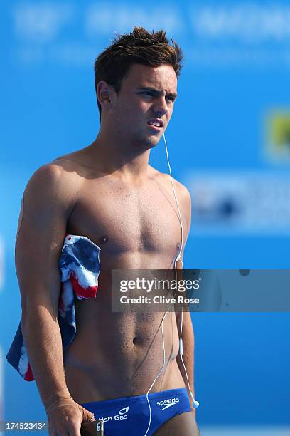 Tom Daley of Great Britain looks on as he competes in the Men's 10m Platform Diving preliminary round on day eight of the 15th FINA World...