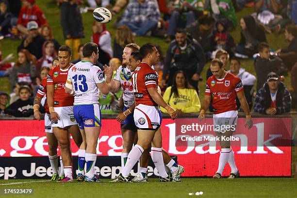 Joel Edwards of the Raiders is congratulated by his team mates after scoring a try during the round 20 match between the St George Illawarra Dragons...