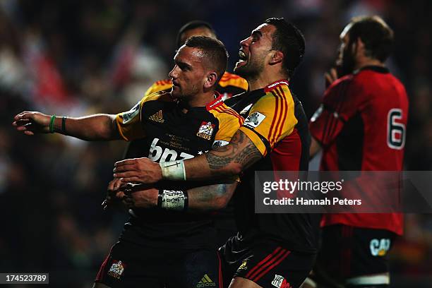 Aaron Cruden of the Chiefs celebrates with Liam Messam of the Chiefs after scoring a try during the Super Rugby semi final match between the Chiefs...