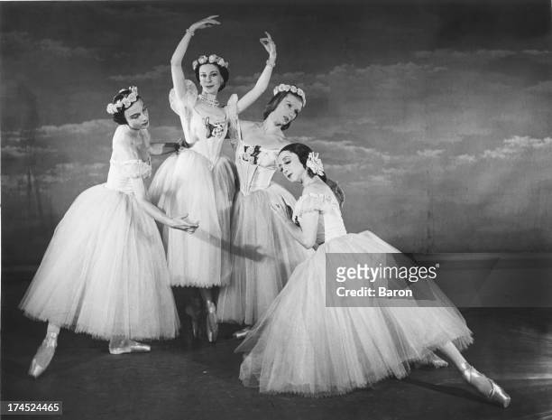 The cast of a Festival Ballet production of Jules Perrot's ballet 'Pas De Quatre', at a photo-call, London, 1950. The dancers are Nathalie Krassovska...