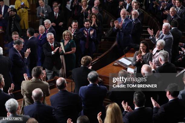 Republican Representatives cheer after nominating Rep. Mike Johnson on the House floor before the fourth vote to elect a new House Speaker at the...