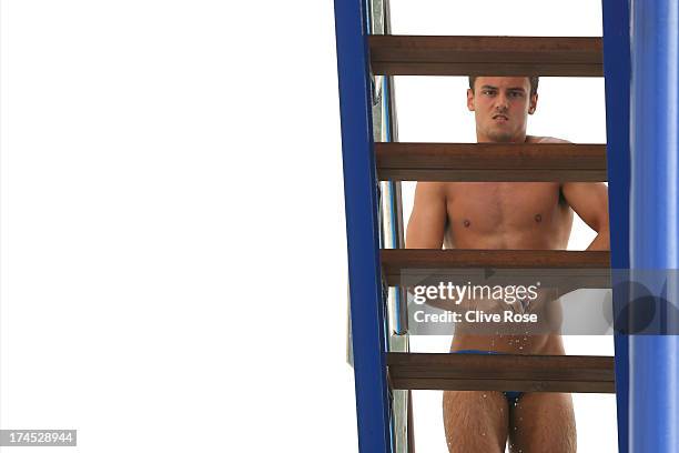 Tom Daley of Great Britain looks on as he competes in the Men's 10m Platform Diving preliminary round on day eight of the 15th FINA World...