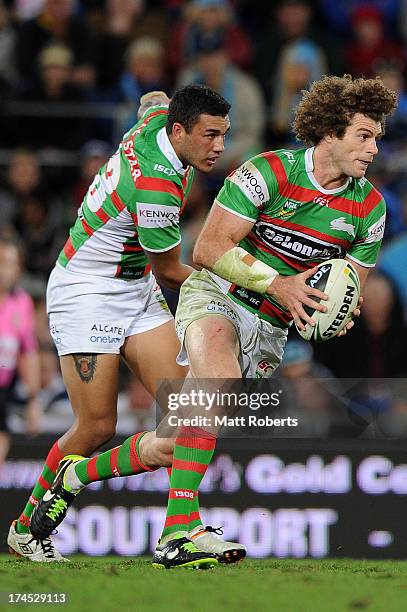 Matt King of the Rabbitohs runs the ball in attack during the round 20 NRL match between the Gold Coast Titans and the South Sydney Rabbitohs at...