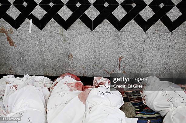 Bodies of supporters of deposed Egyptian President Mohammed Morsi lie on the floor of a field hospital, after reportedly being killed in fighting...