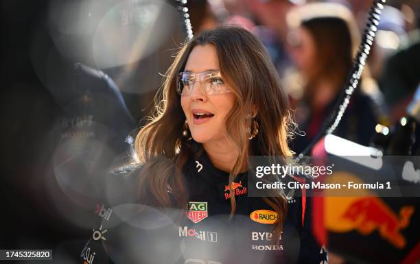 Drew Barrymore takes part in the Red Bull Racing pit stop practice during previews ahead of the F1 Grand Prix of United States at Circuit of The...