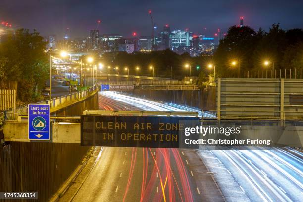 An illuminated sign on the A38m motorway warns drivers of vehicles that they are entering the Birmingham Clean Air Zone on October 19, 2023 in...