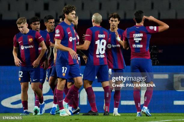 Barcelona's Spanish forward Ferran Torres celebrates scoring the opening goal during the UEFA Champions League 1st round Group H football match...
