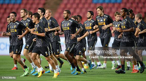 Iago Aspas , Jordan Henderson , Philippe Coutinho , Glen Johnson , Andre Wisdom jog during a Liverpool FC training session at Rajamangala Stadium on...