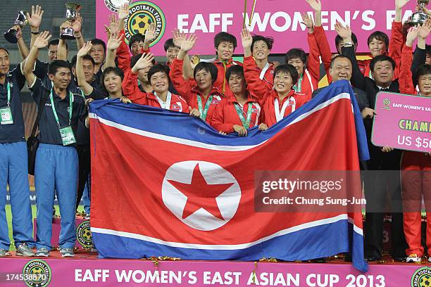 Korea DPR players celebrate after winning the EAFF Women's East Asian Cup 2013 at Jamsil Stadium on July 27, 2013 in Seoul, South Korea.