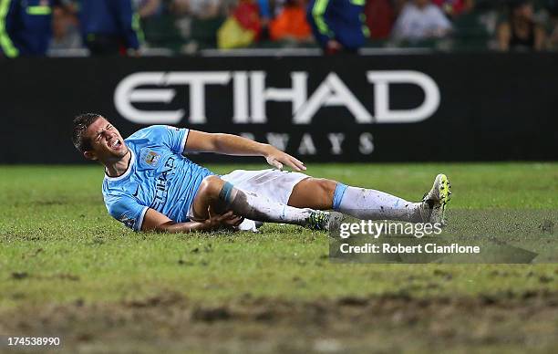 Matija Nastasic of Mancester City suffers an injury during the Barclays Asia Trophy Final match between Manchester City and Sunderland at Hong Kong...