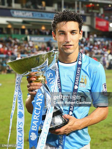 Jesus Navas of Mancester City holds the Asia trophy after Mancester City defeated Sunderland at the Barclays Asia Trophy Final match between...