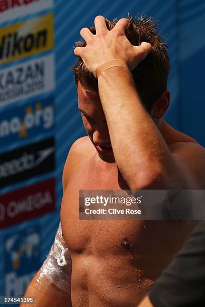 Tom Daley of Great Britain receives an ice pack on his arm during the Men's 10m Platform Diving Semifinal round on day eight of the 15th FINA World...