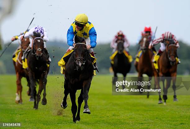 Johnny Murtagh riding Novellist win The King George VI and Queen Elizabeth Stakes at Ascot racecourse on July 27, 2013 in Ascot, England.