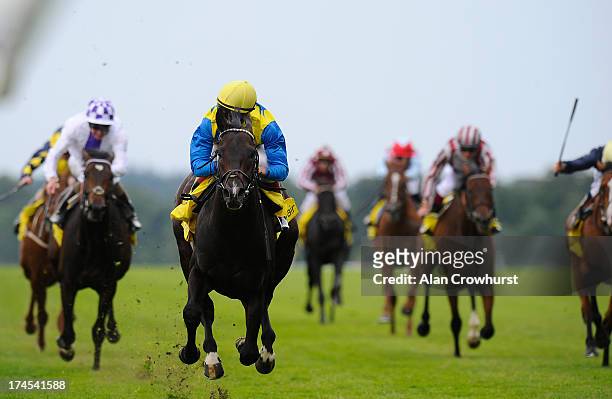 Johnny Murtagh riding Novellist win The King George VI and Queen Elizabeth Stakes at Ascot racecourse on July 27, 2013 in Ascot, England.