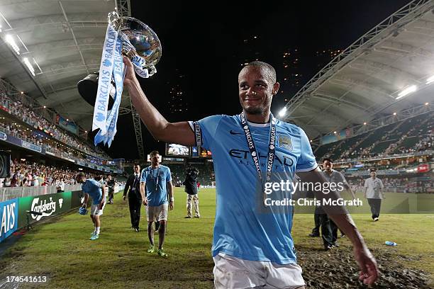 Vincent Kompany of Manchester City celebrates with the trophy during the Barclays Asia Trophy Final match between Manchester City and Sunderland at...