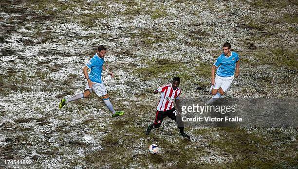 Stephane Sessegnon of Sunderland AFC controls the ball ahead of Javi Garcia and Matija Nastasic of Mancester City FC during the Barclays Asia Trophy...