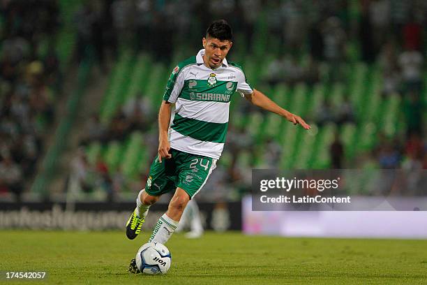 Oribe Peralta of Santos drives the ball during a match between Santos and Cruz Azul as part of the Apertura 2013 Liga MX at Modelo stadium, on July...