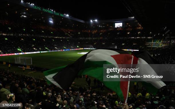 General view of Celtic Park as the fans hold up Palestine flags during a UEFA Champions League match between Celtic and Atletico de Madrid at Celtic...