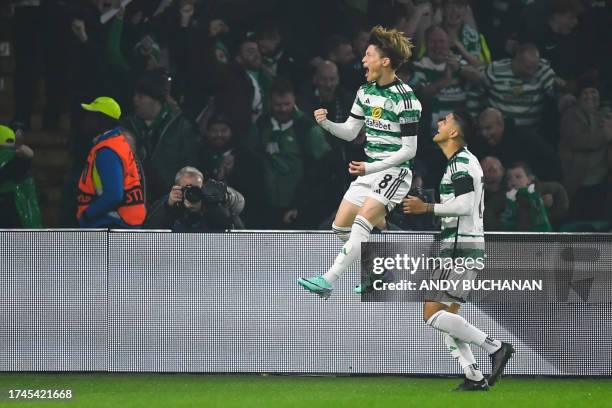 Celtic's Japanese striker Kyogo Furuhashi celebrates after scoring his team first goal during the UEFA Champions League group E football match...