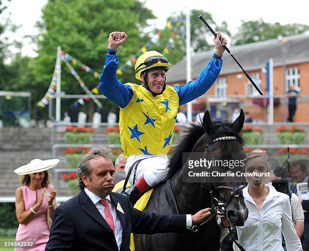 Johnny Murtagh celebrates on entry into the winners enclosure on Novellist after winning The King George VI and Queen Elizabeth Stakes at Ascot...