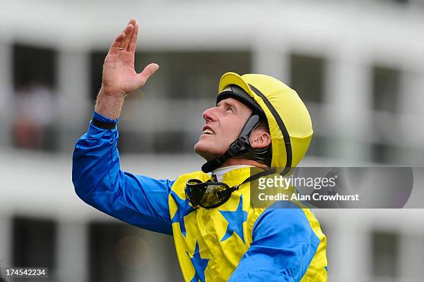 Johnny Murtagh celebrates after riding Novellist to win The King Geirge VI Queen Elizabeth Stakes at Ascot racecourse on July 27, 2013 in Ascot,...