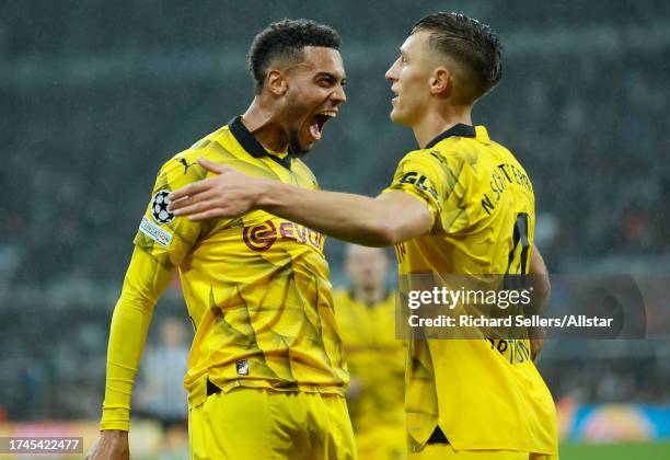 Felix Nmecha of Borussia Dortmund and Nico Schlotterbeck of Borussia Dortmund celebrates 1st goal during the UEFA Champions League match between...