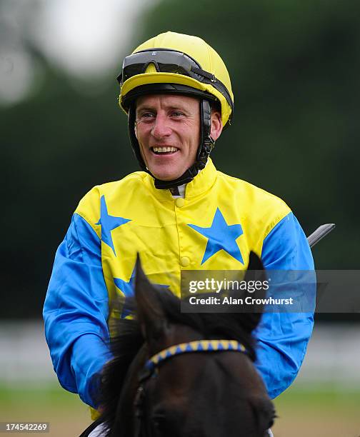 Johnny Murtagh celebrates after riding Novellist to win The King Geirge VI Queen Elizabeth Stakes at Ascot racecourse on July 27, 2013 in Ascot,...