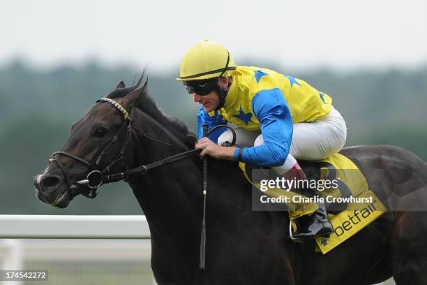 Johnny Murtagh rides Novellist to the win in The King George VI and Queen Elizabeth Stakes at Ascot racecourse on July 27, 2013 in Ascot, England.