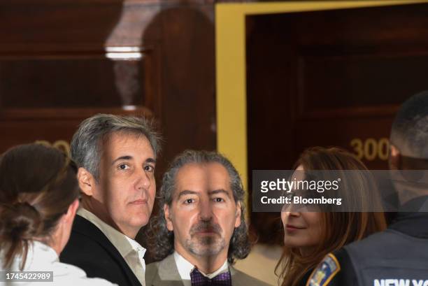 Michael Cohen, former personal lawyer to US President Donald Trump, center left, at New York State Supreme Court in New York, US, on Wednesday, Oct....