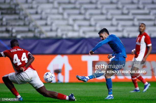 Porto's Canadian midfielder Stephen Eustaquio shoots and scores his team's second goal during the UEFA Champions League Group H football match...