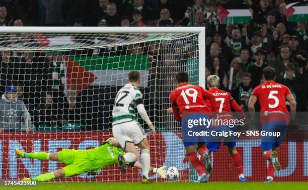 Atletico Madrid's Antoinne Griezmann has a penalty saved by Celtic's Joe Hart before scoring the rebound to make it 1-1 during a UEFA Champions...