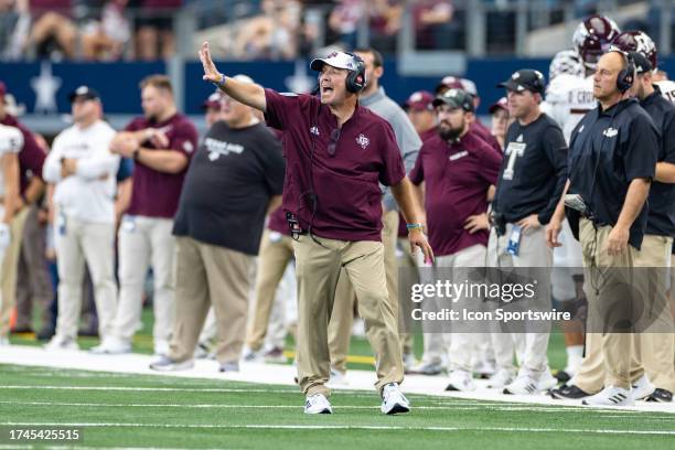 Texas A&M Aggies head coach Jimbo Fisher calls out a play from the sideline during the Southwest Classic college football game between the Texas A&M...