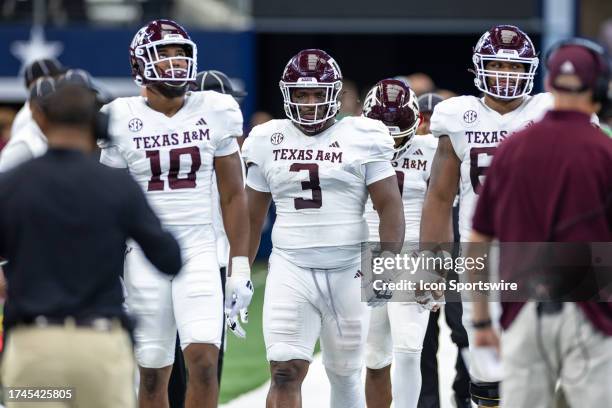 Texas A&M Aggies defensive lineman McKinley Jackson and the Aggies captains walk on to the field during the Southwest Classic college football game...