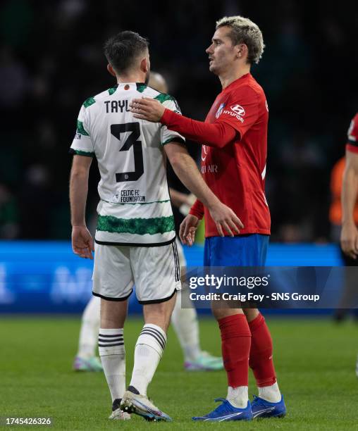 Celtic's Greg Taylor and Atletico Madrid's Antoinne Griezmann at full time during a UEFA Champions League match between Celtic and Atletico de Madrid...