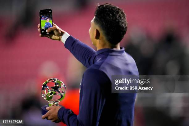 Evanilson of FC Porto celebrates the man of the match award by taking a selfie after the UEFA Champions League Group H match between Royal Antwerp FC...