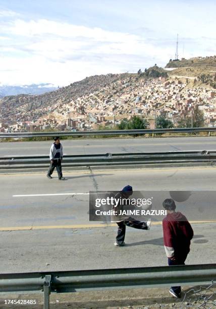 Children play soccer on the streets during election day 30 June 2002 in La Paz, Boivia. Bolivians headed for the polls early 30 June to elect a new...