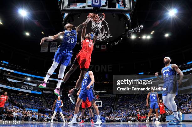 Jabari Smith Jr. #10 of the Houston Rockets dunks the ball during the game against the Orlando Magic on October 25, 2023 at Amway Center in Orlando,...