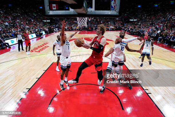 Gradey Dick of the Toronto Raptors drives to the basket during the game against the Minnesota Timberwolves on October 25, 2023 at the Scotiabank...