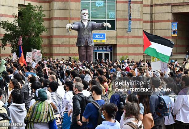 Students gather near a Halloween decoration of Frankenstein's Monster during a "Walkout to fight Genocide and Free Palestine" at Bruin Plaza at UCLA...