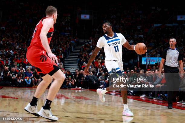 Naz Reid of the Minnesota Timberwolves dribbles the ball during the game against the Toronto Raptors on October 25, 2023 at the Scotiabank Arena in...