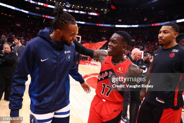 Leonard Miller of the Minnesota Timberwolves and Dennis Schroder of the Toronto Raptors laugh after the game on October 25, 2023 at the Scotiabank...