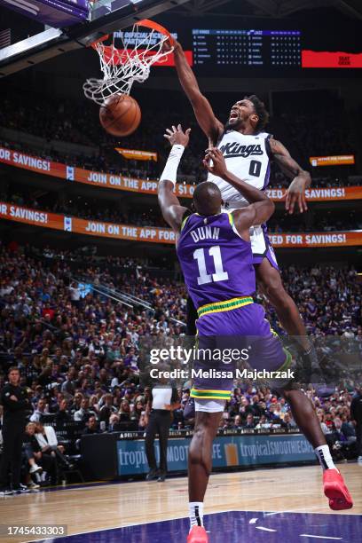 Malik Monk of the Sacramento Kings dunks the ball during the game against the Utah Jazz on October 25, 2023 at Delta Center in Salt Lake City, Utah....