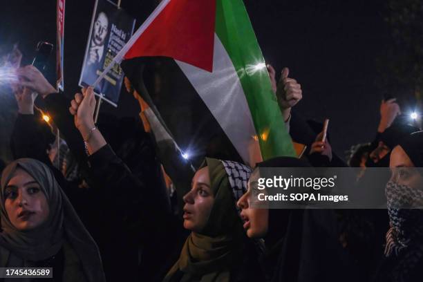Protester holds a Palestinian flag during the demonstration. The Mavi Marmara Group assembled in Edirnekap, Istanbul to express their support for the...