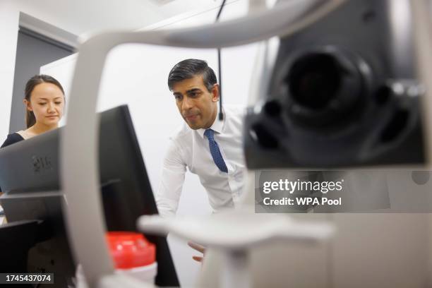 Prime minister Rishi Sunak is shown a Retinal Scan procedure being performed by Dr. Siegfried Wagner, senior research fellow, and Dr Xiao Liu with...