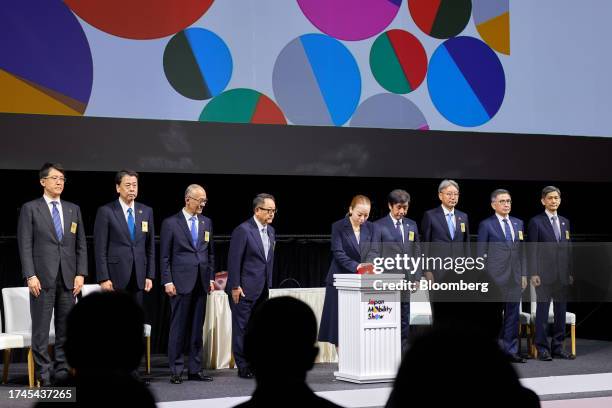 Japan's princess Yoko of Mikasa, center, with automakers executives, from left, Koji Sato, president of Toyota Motor Corp., Makoto Uchida, chief...